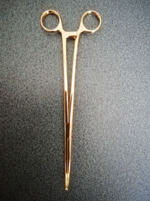 Gynecological forceps in 18kt yellow gold 