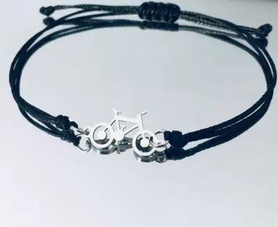 Brazalete de acero para bicicleta de montaña con cordón de color a elegir 